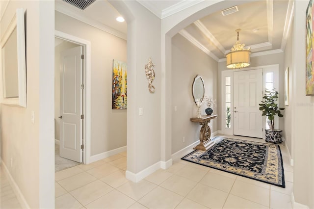 4540 Terrazza Ct, Bradenton, FL 34211 - entrance foyer with crown molding, arched walkways, light tile patterned floors, a raised ceiling, and recessed lighting