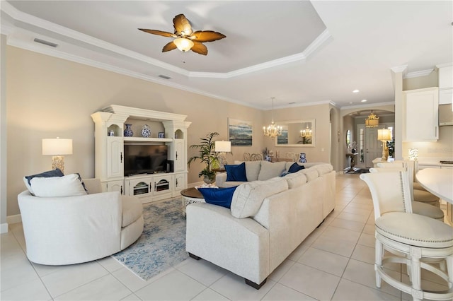 4540 Terrazza Ct, Bradenton, FL 34211 - living room with a chandelier, a raised ceiling, a ceiling fan, arched walkways, and light tile patterned floors
