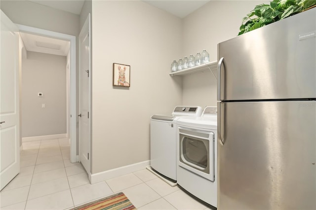 4540 Terrazza Ct, Bradenton, FL 34211 - washroom with washer and dryer and light tile patterned floors