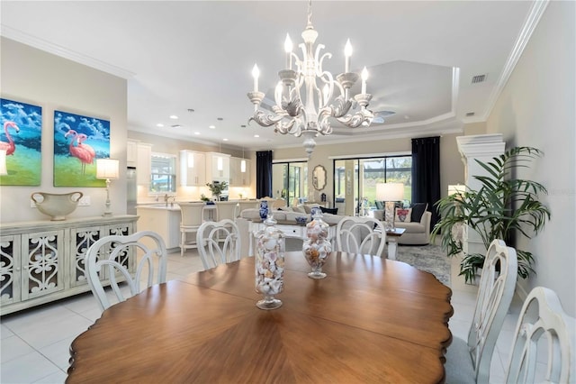 4540 Terrazza Ct, Bradenton, FL 34211 - dining room with light tile patterned floors, ornamental molding, a chandelier, and recessed lighting