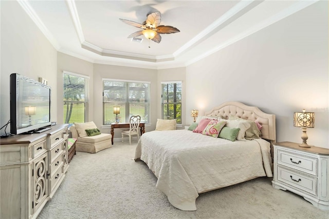 4540 Terrazza Ct, Bradenton, FL 34211 - bedroom with light carpet, crown molding, a tray ceiling, and ceiling fan