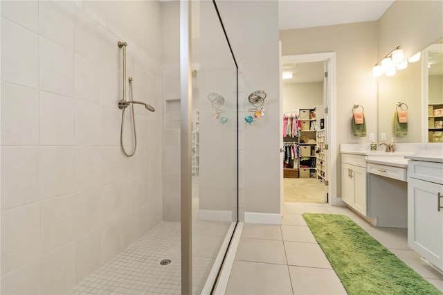 4540 Terrazza Ct, Bradenton, FL 34211 - bathroom featuring vanity, a walk in shower, a spacious closet, and tile patterned floors