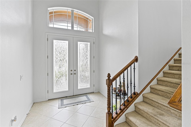 3671 Summerwind Cir, Bradenton, FL 34209 - entryway featuring stairs, light tile patterned flooring, french doors, and baseboards