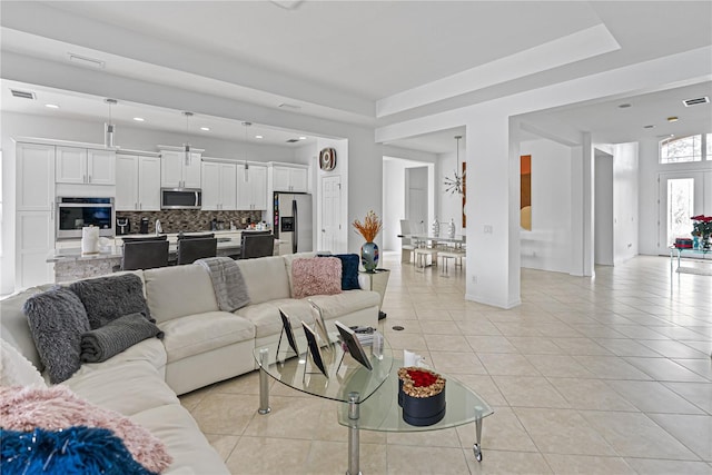 3671 Summerwind Cir, Bradenton, FL 34209 - living area featuring light tile patterned floors, recessed lighting, and baseboards