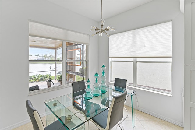 3671 Summerwind Cir, Bradenton, FL 34209 - tiled dining space featuring a chandelier, a water view, and baseboards