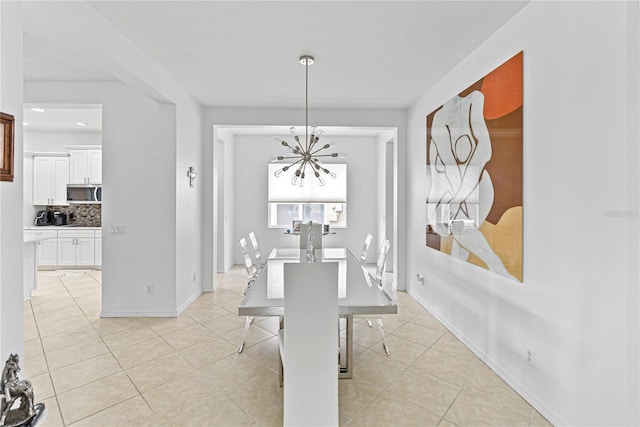3671 Summerwind Cir, Bradenton, FL 34209 - dining space featuring a chandelier, light tile patterned floors, and baseboards
