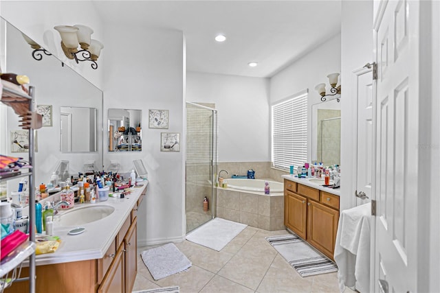3671 Summerwind Cir, Bradenton, FL 34209 - bathroom with tile patterned flooring, vanity, a stall shower, and a garden tub