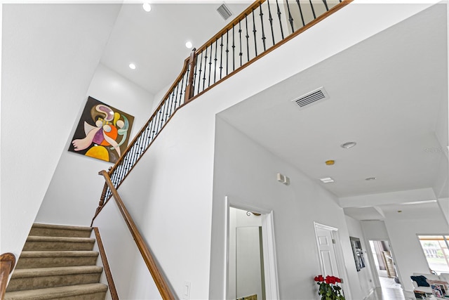 3671 Summerwind Cir, Bradenton, FL 34209 - staircase with a towering ceiling and recessed lighting