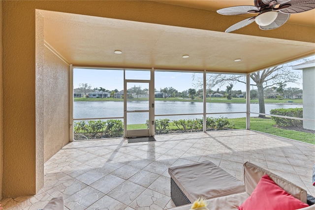 3671 Summerwind Cir, Bradenton, FL 34209 - sunroom / solarium featuring floor to ceiling windows, a water view, healthy amount of natural light, and a textured wall
