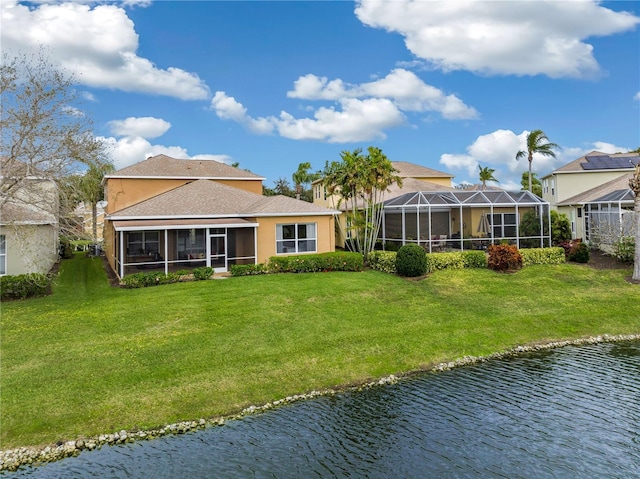 3671 Summerwind Cir, Bradenton, FL 34209 - back of house with a water view, a yard, stucco siding, and a sunroom