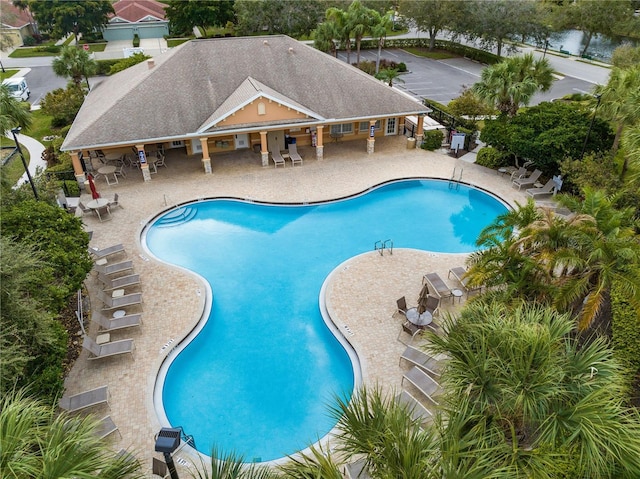 3671 Summerwind Cir, Bradenton, FL 34209 - community pool with a patio