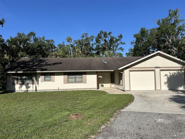 3804 65th St E, Bradenton, FL 34208 - ranch-style home with a garage, concrete driveway, and a front yard