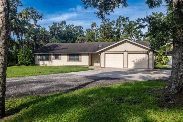 3804 65th St E, Bradenton, FL 34208 - single story home featuring a garage, driveway, and a front lawn