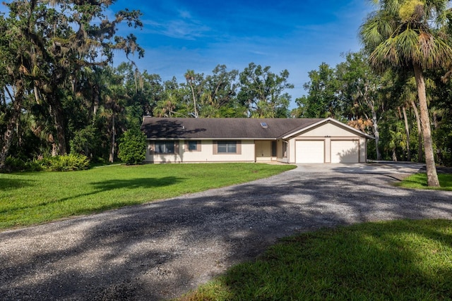 3804 65th St E, Bradenton, FL 34208 - single story home with a garage, driveway, and a front lawn