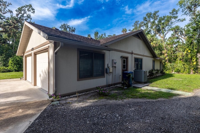 3804 65th St E, Bradenton, FL 34208 - view of front of house with driveway, a garage, a front yard, and a shingled roof