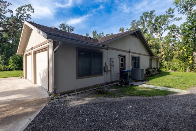 3804 65th St E, Bradenton, FL 34208 - view of home's exterior featuring concrete driveway, a yard, and an attached garage