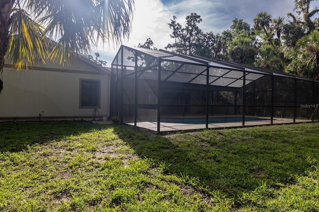 3804 65th St E, Bradenton, FL 34208 - rear view of house featuring a yard and an outdoor pool