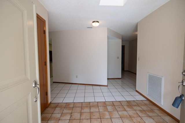 3804 65th St E, Bradenton, FL 34208 - empty room with light tile patterned flooring and baseboards