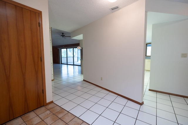 3804 65th St E, Bradenton, FL 34208 - corridor featuring light tile patterned floors and a textured ceiling