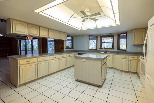 3804 65th St E, Bradenton, FL 34208 - kitchen featuring a ceiling fan, light tile patterned floors, a center island, and a peninsula