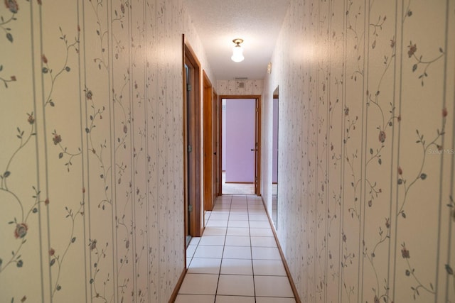 3804 65th St E, Bradenton, FL 34208 - hall with light tile patterned floors and wallpapered walls