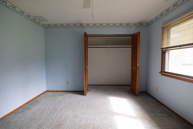 3804 65th St E, Bradenton, FL 34208 - unfurnished bedroom with carpet floors, a closet, and ceiling fan