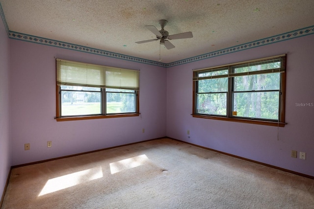 3804 65th St E, Bradenton, FL 34208 - carpeted spare room with plenty of natural light, a textured ceiling, and a ceiling fan