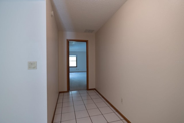 3804 65th St E, Bradenton, FL 34208 - corridor with a textured ceiling and light tile patterned floors