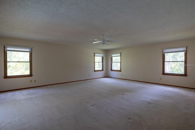 3804 65th St E, Bradenton, FL 34208 - unfurnished room featuring light carpet, ceiling fan, and a textured ceiling