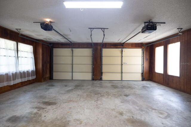 3804 65th St E, Bradenton, FL 34208 - garage with a garage door opener and wood walls