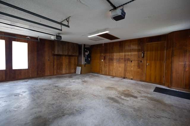 3804 65th St E, Bradenton, FL 34208 - garage with a garage door opener and wood walls