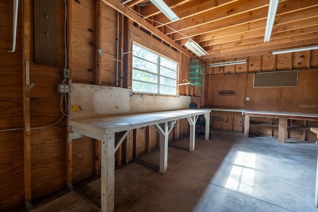 3804 65th St E, Bradenton, FL 34208 - miscellaneous room featuring unfinished concrete flooring and a workshop area