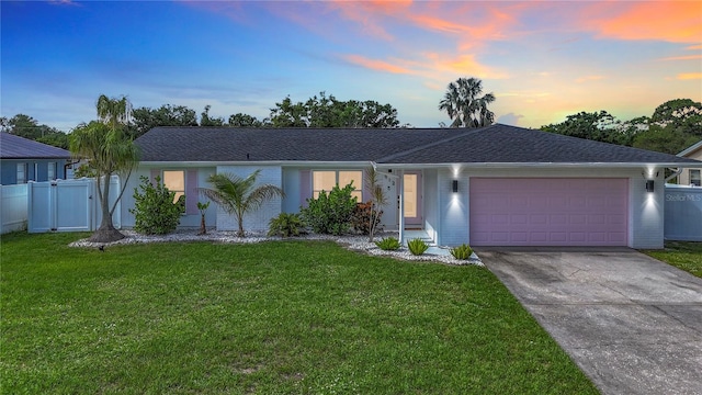 912 Ponderosa Pine Ln, Sarasota, FL 34243 - single story home featuring a garage, concrete driveway, brick siding, and a gate