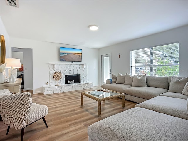 912 Ponderosa Pine Ln, Sarasota, FL 34243 - living room with wood finished floors and a stone fireplace
