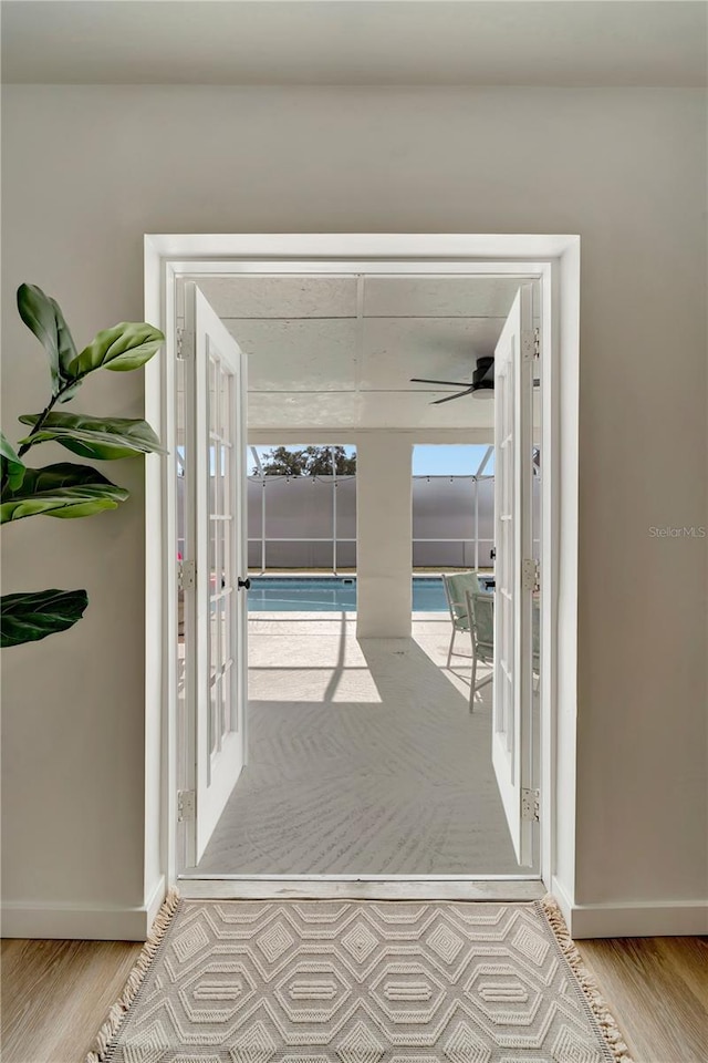912 Ponderosa Pine Ln, Sarasota, FL 34243 - hallway with french doors and wood finished floors