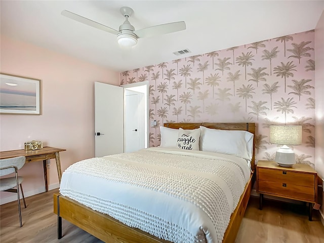 912 Ponderosa Pine Ln, Sarasota, FL 34243 - bedroom featuring wallpapered walls, wood finished floors, and a ceiling fan