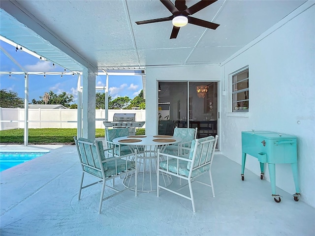 912 Ponderosa Pine Ln, Sarasota, FL 34243 - view of patio with ceiling fan, an outdoor kitchen, and outdoor dining space