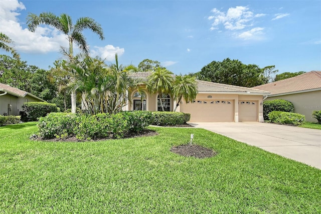 7464 Ridge Rd, Sarasota, FL 34238 - view of front facade featuring driveway, a garage, stucco siding, a front yard, and a tiled roof