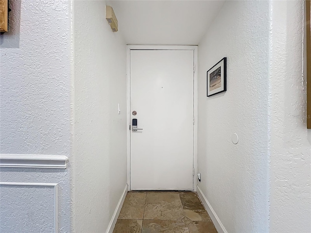 2220 Bahia Vista St Unit G4, Sarasota, FL 34239 - entryway with baseboards and stone finish flooring