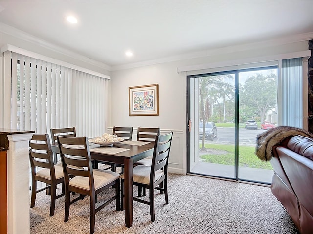 2220 Bahia Vista St Unit G4, Sarasota, FL 34239 - dining area featuring crown molding, light colored carpet, a wainscoted wall, and recessed lighting