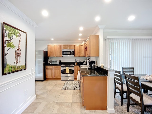 2220 Bahia Vista St Unit G4, Sarasota, FL 34239 - kitchen with appliances with stainless steel finishes, crown molding, recessed lighting, light tile patterned flooring, and dark stone counters