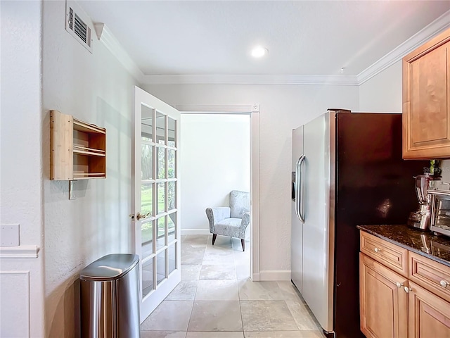 2220 Bahia Vista St Unit G4, Sarasota, FL 34239 - kitchen featuring ornamental molding, dark stone counters, stainless steel fridge with ice dispenser, and light tile patterned flooring