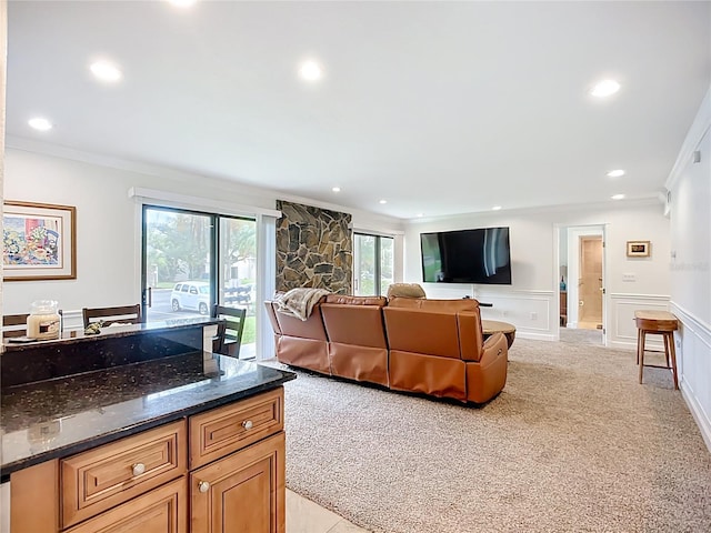 2220 Bahia Vista St Unit G4, Sarasota, FL 34239 - living area featuring crown molding, recessed lighting, light colored carpet, a decorative wall, and wainscoting