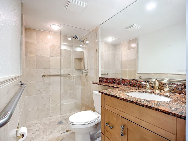 2220 Bahia Vista St Unit G4, Sarasota, FL 34239 - bathroom with vanity, a tile shower, tile walls, and recessed lighting