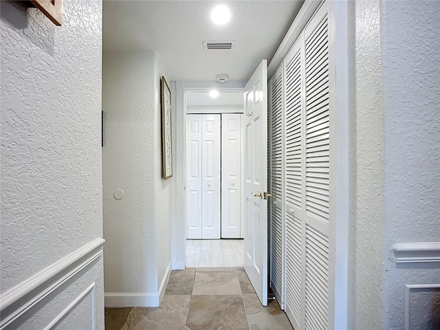 2220 Bahia Vista St Unit G4, Sarasota, FL 34239 - hall with a textured wall and baseboards