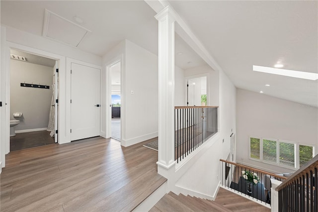 1484 Seafarer Dr, Osprey, FL 34229 - hall with wood finished floors and an upstairs landing