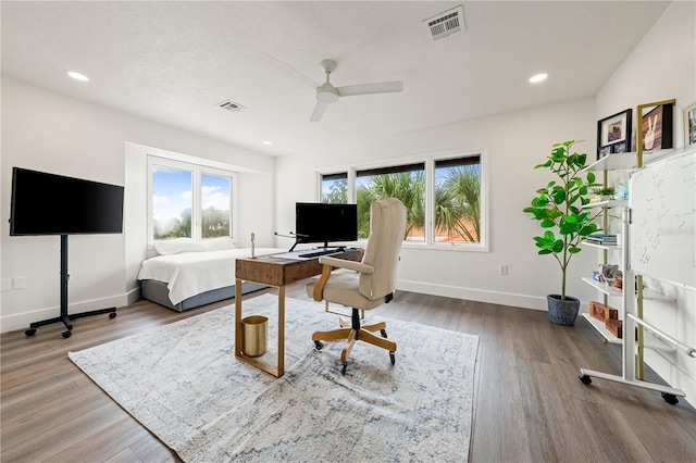 1484 Seafarer Dr, Osprey, FL 34229 - office featuring a ceiling fan, wood finished floors, and recessed lighting