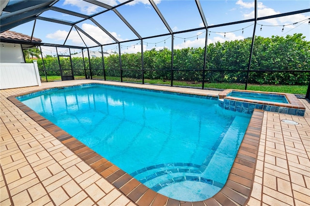1484 Seafarer Dr, Osprey, FL 34229 - view of pool with a pool with connected hot tub, glass enclosure, and a patio