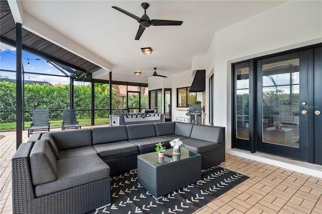 1484 Seafarer Dr, Osprey, FL 34229 - view of patio featuring an outdoor hangout area, a ceiling fan, exterior kitchen, and a lanai