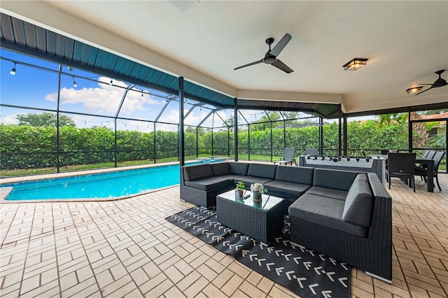 1484 Seafarer Dr, Osprey, FL 34229 - outdoor pool with outdoor lounge area, ceiling fan, a patio, and glass enclosure